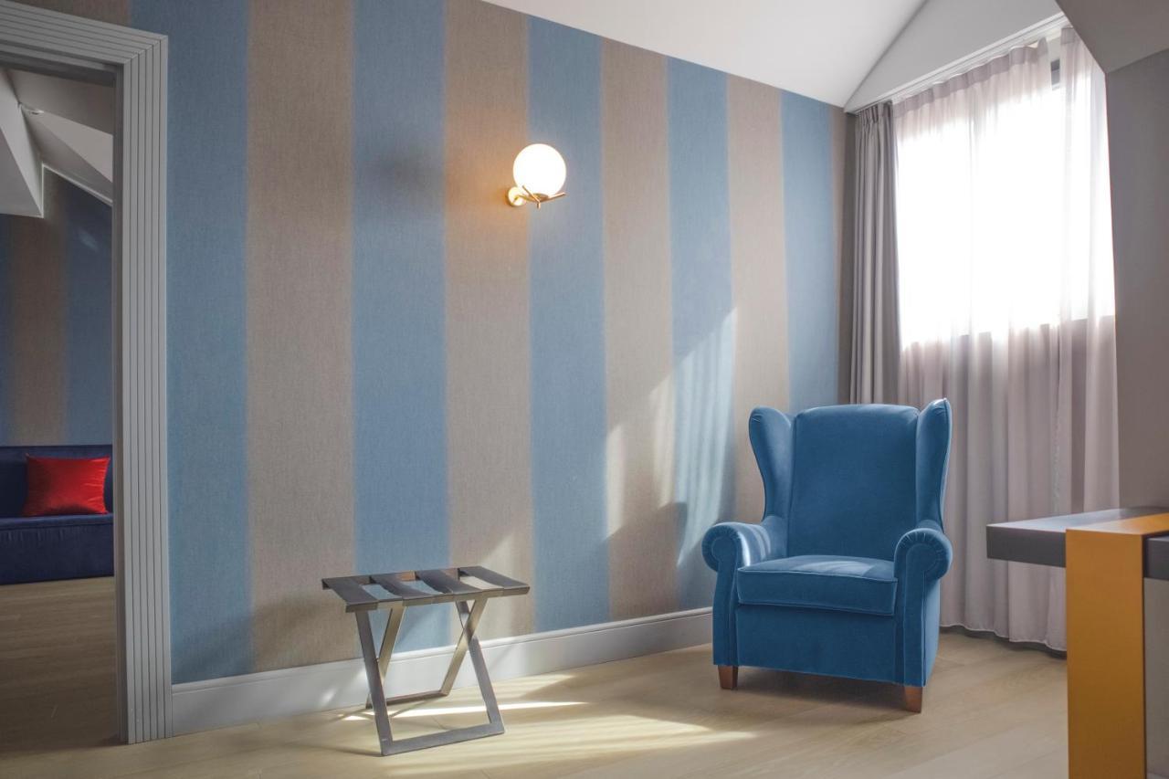 Palazzo Cornalia Hotel Milano Eksteriør billede A room with a wall decorated with a venetian plaster